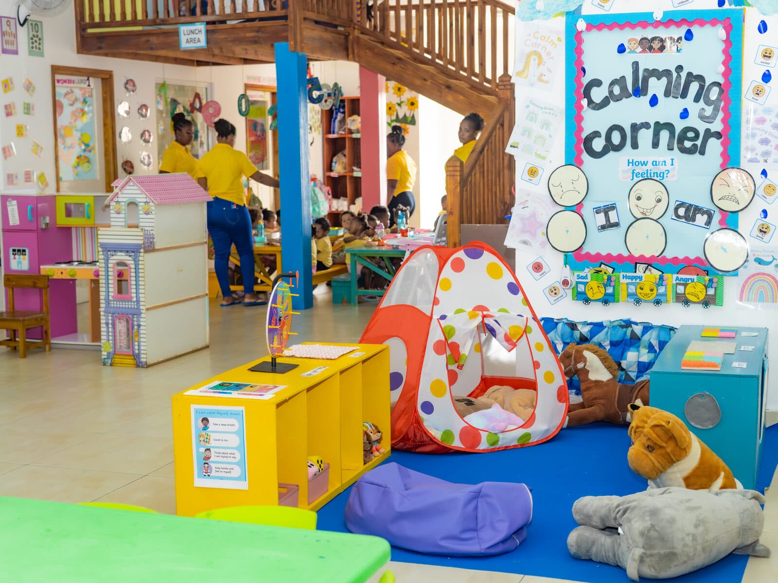 Children exploring a colourful sensory activity board together