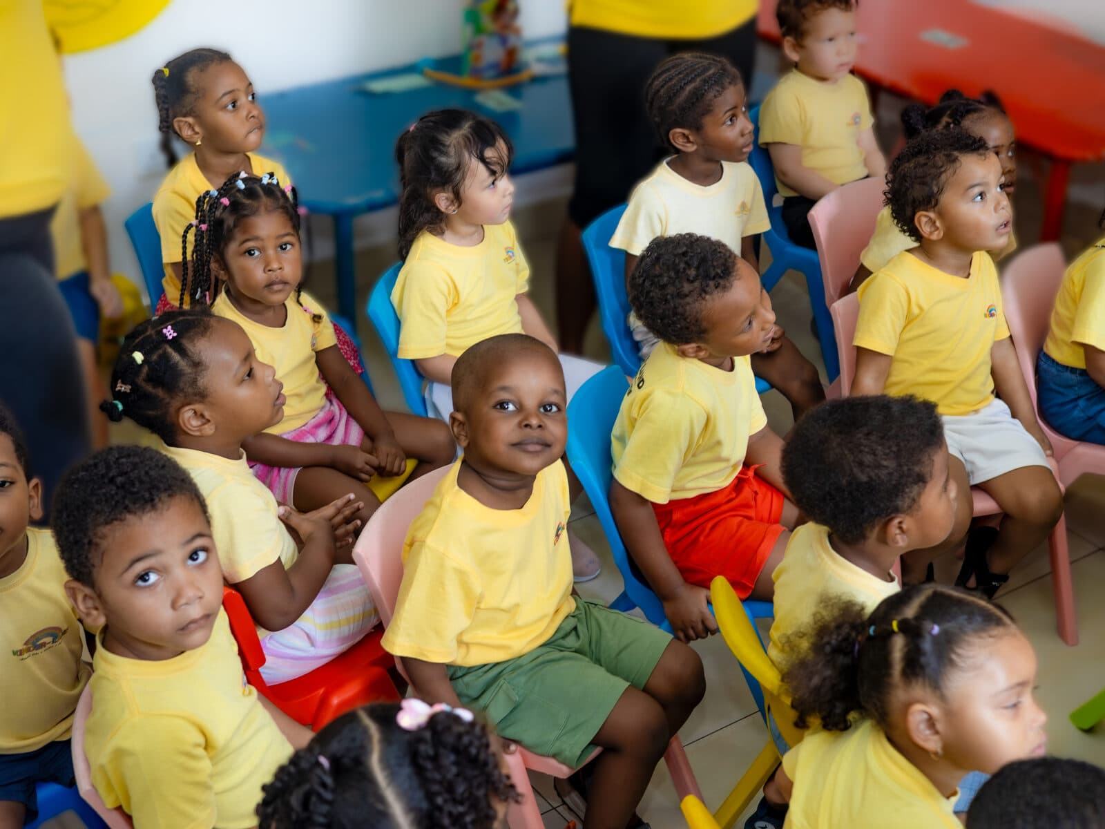 A group of children seated together during a classroom activity
