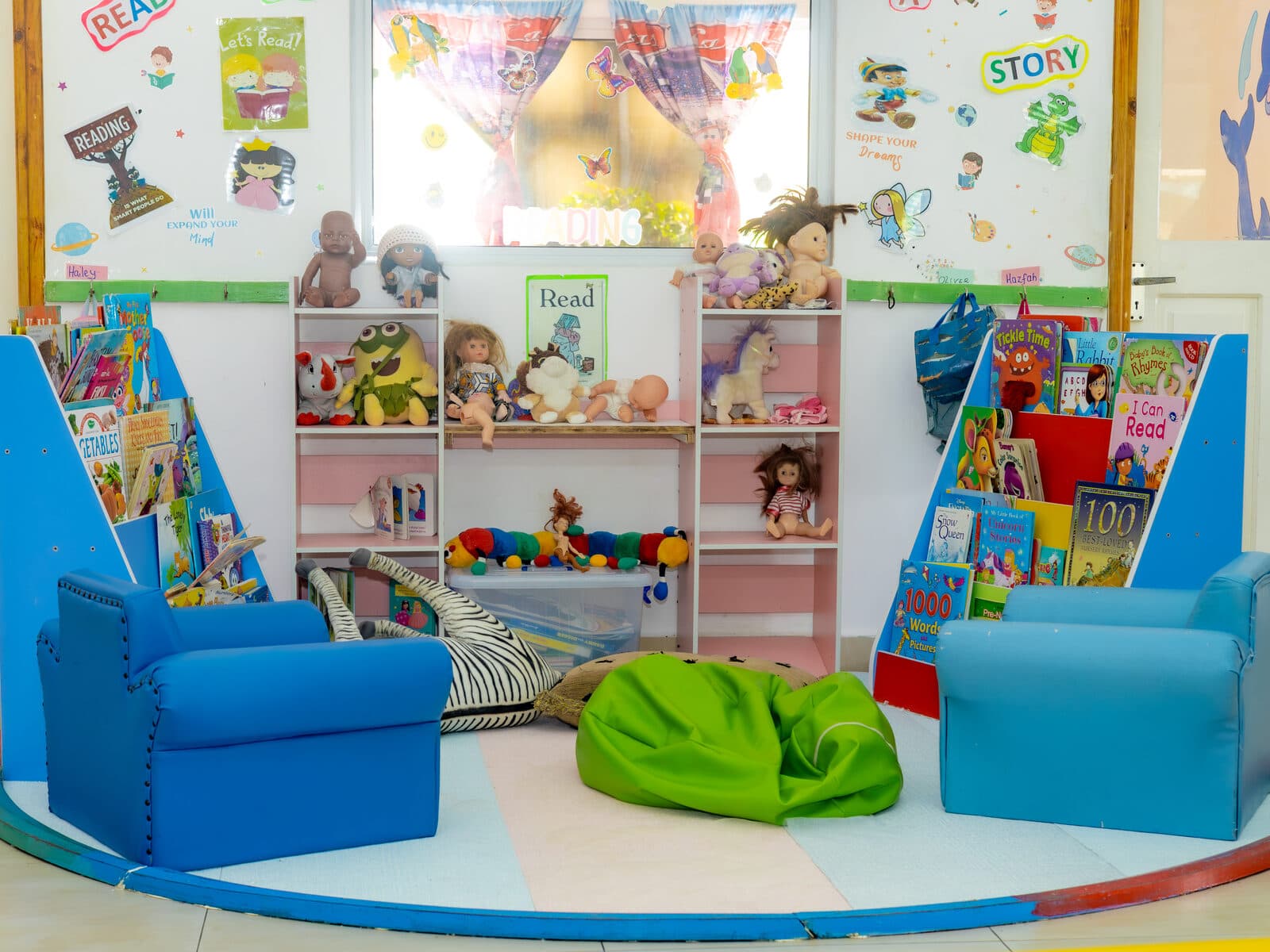 A cosy reading nook with books and soft seating